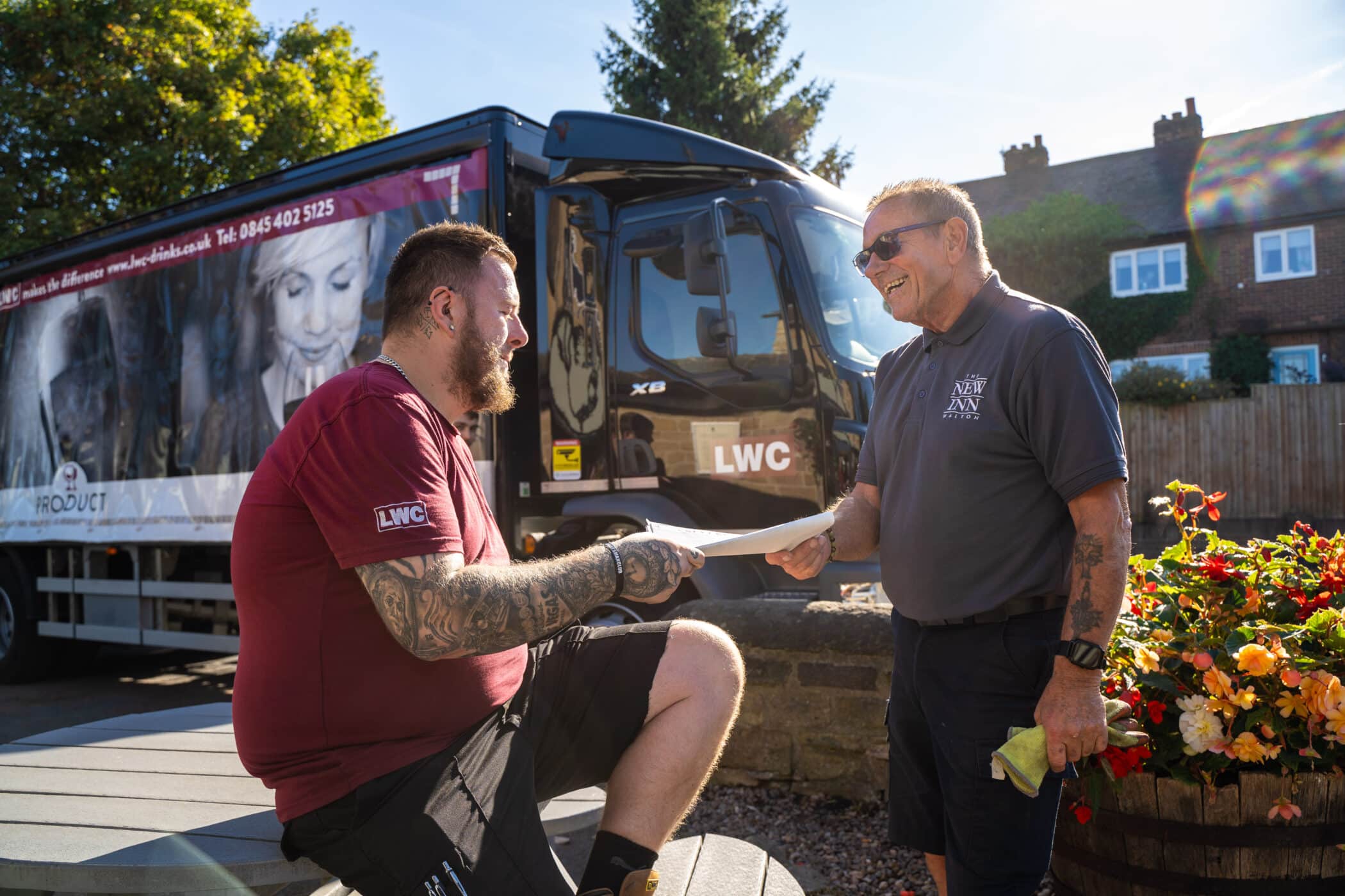 LWC Driver delivering to a customer